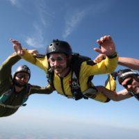 aff skydiving student smiles in freefall